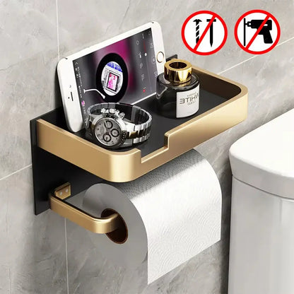 Toilet Paper Roll Holder Phone Shelf in gold with black base, featuring no-drill installation and storage for phone, watch, and perfume.